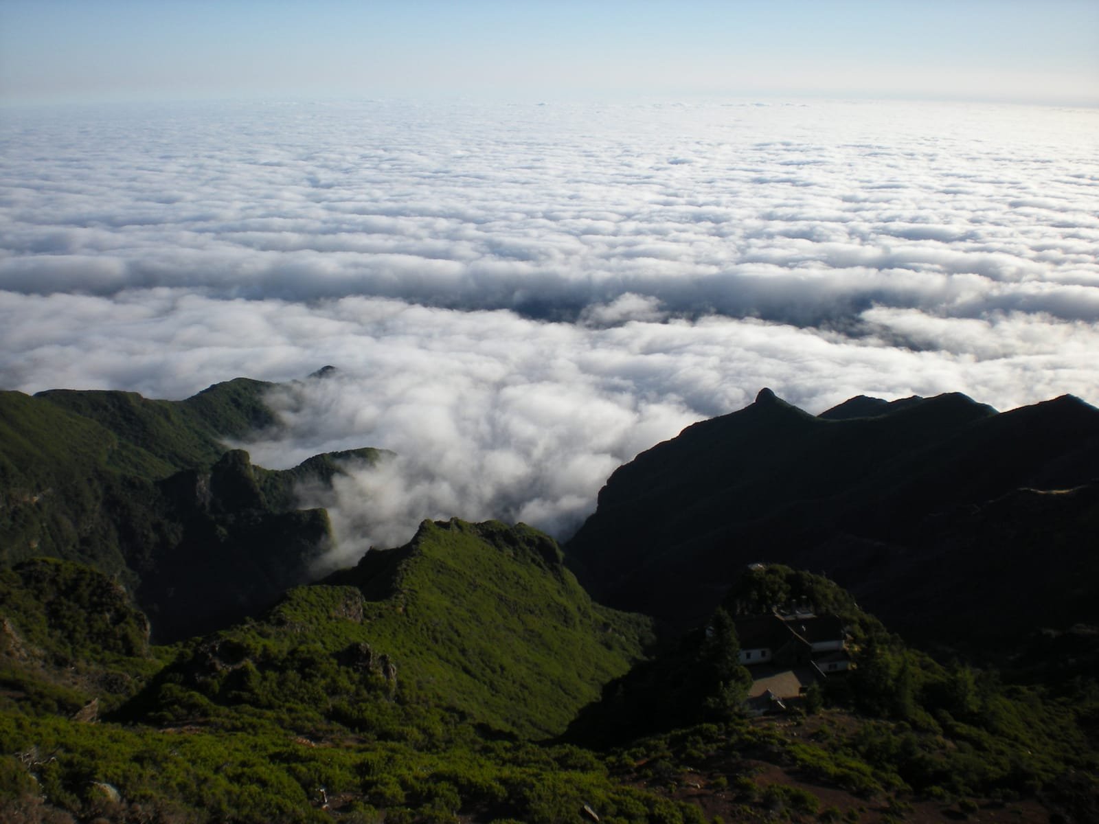 Sunrise above the clouds seen from Pico Ruivo